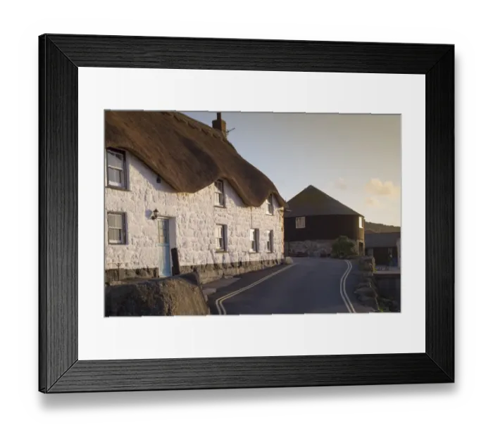 Framed Print : Old fishermans cottage and The Roundhouse (old capstan house) in coastal village at sunset, Sennen Cove, Sennen Framed Print : Old fishermans cottage and The Roundhouse (old capstan house) in coastal village at sunset, Sennen Cove, Sennen