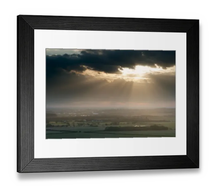 Framed Print : Sunbeams illuminating fields in rural landscape, near Ashford, North Downs, Kent, England, March Framed Print : Sunbeams illuminating fields in rural landscape, near Ashford, North Downs, Kent, England, March