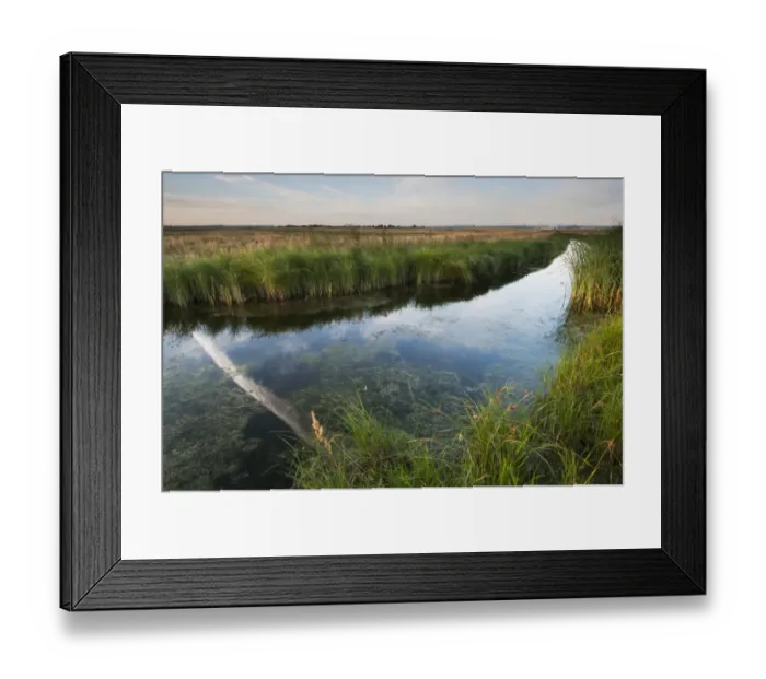 Framed Print : Vapour trail reflected in flooded ditch on coastal grazing marsh habitat, Elmley Marshes N. N. R Framed Print : Vapour trail reflected in flooded ditch on coastal grazing marsh habitat, Elmley Marshes N. N. R