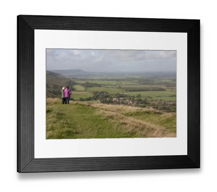 Framed Print : Walkers standing at viewpoint overlooking village and farmland, looking towards Fulking, Devils Dyke, South Downs Framed Print : Walkers standing at viewpoint overlooking village and farmland, looking towards Fulking, Devils Dyke, South Downs