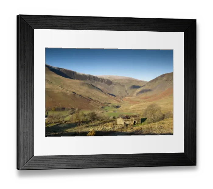Framed Print : View of derelict barn and farmland in fell valley with waterfall in distance Framed Print : View of derelict barn and farmland in fell valley with waterfall in distance
