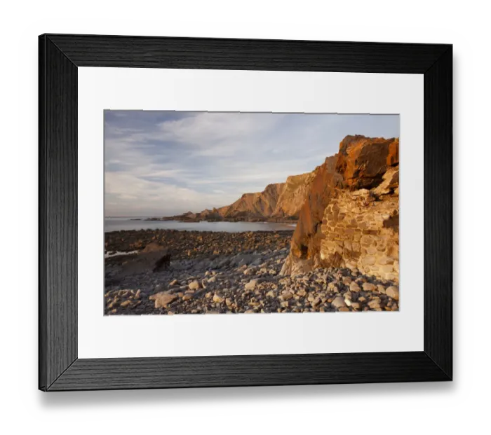Framed Print : Manmade seawall and coastal cliff with folded strata at sunset, Warren Cliffs, Hartland, North Devon, England, October Framed Print : Manmade seawall and coastal cliff with folded strata at sunset, Warren Cliffs, Hartland, North Devon, England, October