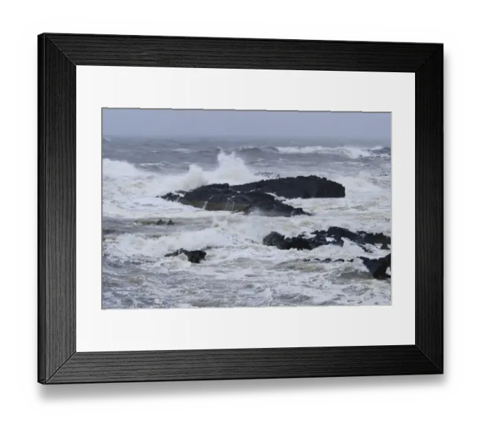 Framed Print : Waves crashing against rocks in stormy weather on east coast, Macduff, Aberdeenshire, Scotland, August