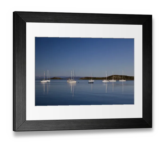 Framed Print : View of yachts moored in bay, with Small Isles in background, Craighouse Bay, Isle of Jura, Inner Hebrides, Scotland