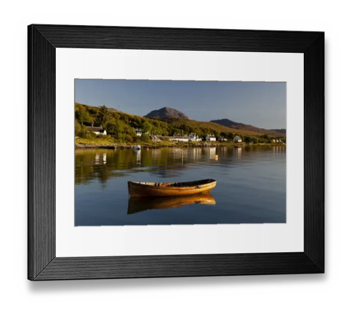 Framed Print : View of small wooden boat and village houses in bay, in morning sunlight, with Beinn Shiantaidh and Corra Bheinn Framed Print : View of small wooden boat and village houses in bay, in morning sunlight, with Beinn Shiantaidh and Corra Bheinn