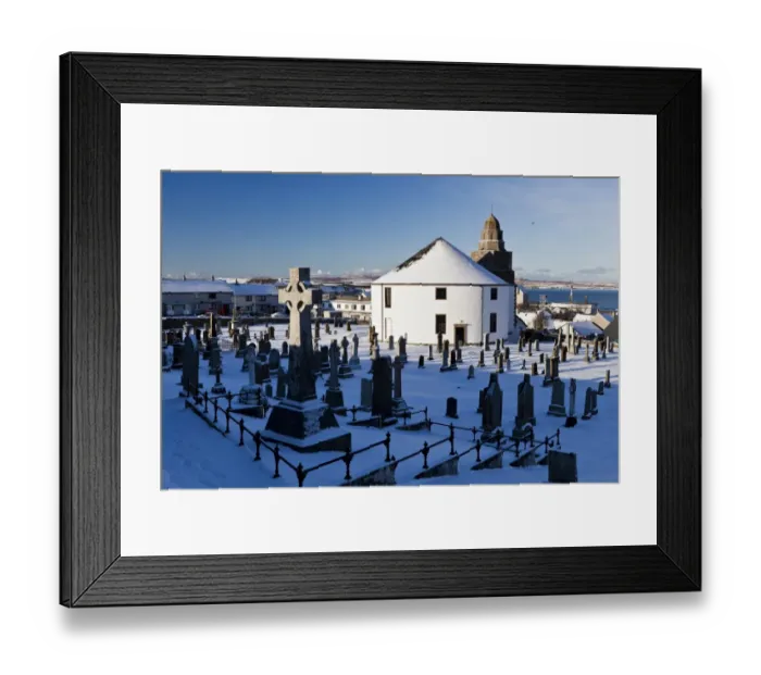 Framed Print : Snow covered cemetery and round church, Kilarrow Parish Church, Bowmore, Isle of Islay, Inner Hebrides, Scotland Framed Print : Snow covered cemetery and round church, Kilarrow Parish Church, Bowmore, Isle of Islay, Inner Hebrides, Scotland