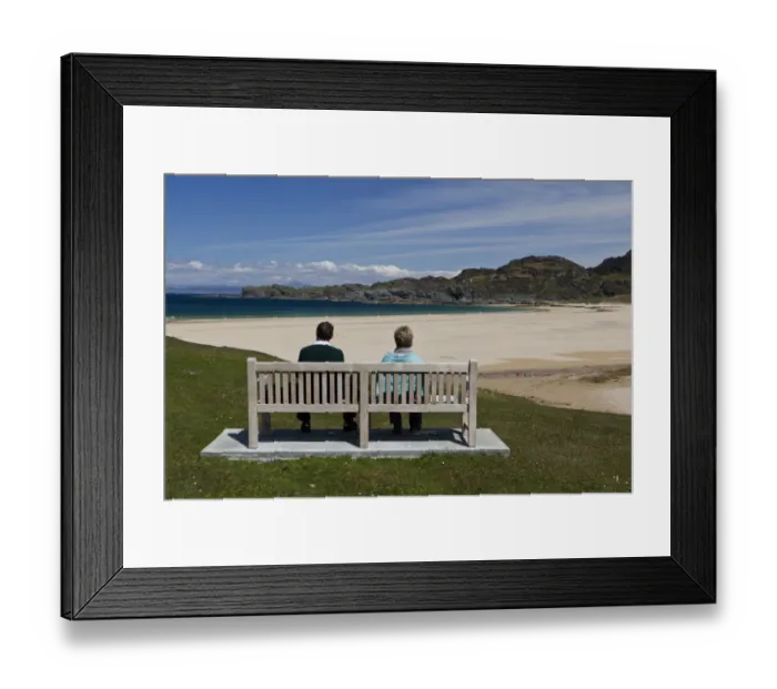 Framed Print : Couple sitting on bench overlooking coastline with sandy beach, Kiloran Bay, Isle of Colonsay, Inner Hebrides, Scotland Framed Print : Couple sitting on bench overlooking coastline with sandy beach, Kiloran Bay, Isle of Colonsay, Inner Hebrides, Scotland