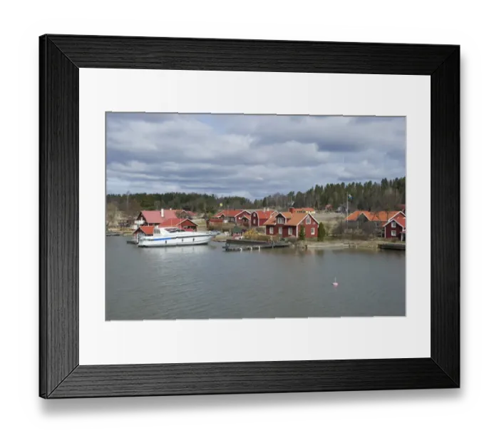 Framed Print : View of coastal settlement with boat in harbour, Bjorsund, Sodermanland, Sweden, april Framed Print : View of coastal settlement with boat in harbour, Bjorsund, Sodermanland, Sweden, april