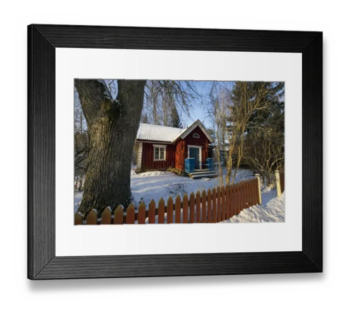 Framed Print : Small cottage with picket fence in snow, Sweden, february Framed Print : Small cottage with picket fence in snow, Sweden, february