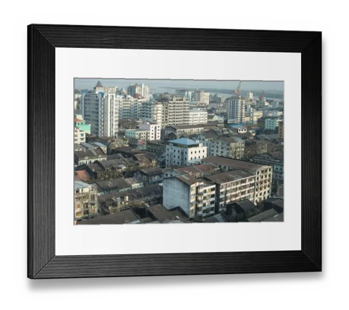Framed Print : View across city rooftops (from Traders Hotel) towards river, Yangon, Myanmar, March