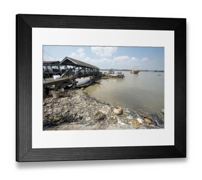 Framed Print : Rubbish at edge of river with jetty and boats, Yangon, Myanmar, March Framed Print : Rubbish at edge of river with jetty and boats, Yangon, Myanmar, March