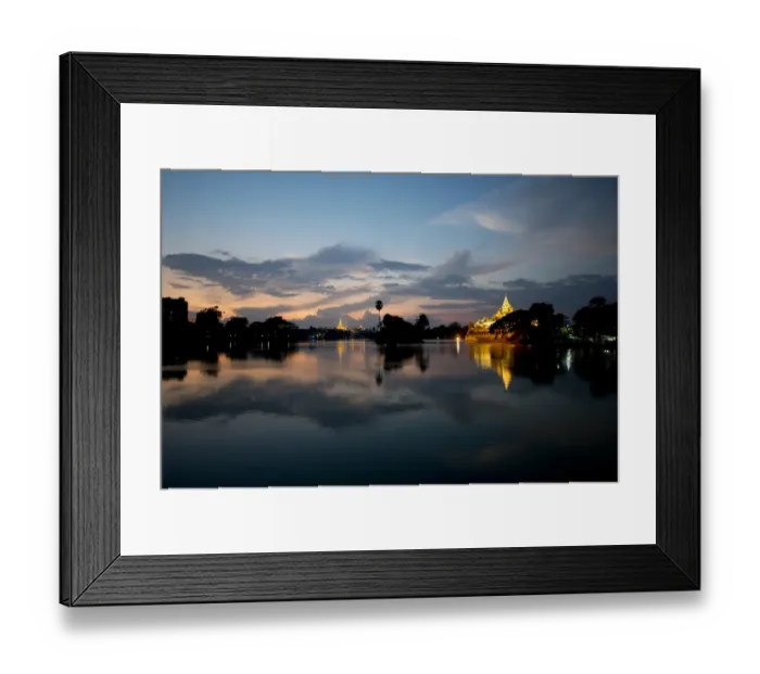 Framed Print : View of Karaweik (concrete reproduction of royal barge) and Shwedagon Pagoda across lake at sunset, Kandawgyi Lake
