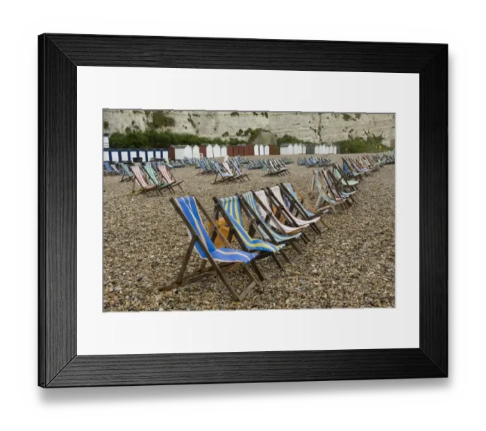 Framed Print : Wet summer day with unused deck chairs, Beer Beach, Devon, England, May Framed Print : Wet summer day with unused deck chairs, Beer Beach, Devon, England, May