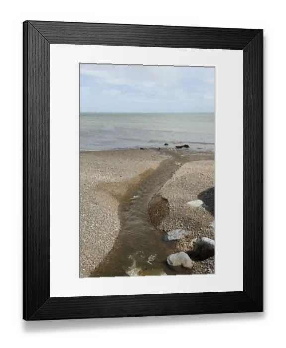 Framed Print : Outlet of the River Sid onto the shingle beach of Sidmouth in Devon Framed Print : Outlet of the River Sid onto the shingle beach of Sidmouth in Devon