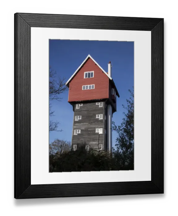 Framed Print : The House in the Clouds is a water tower at Thorpeness, Suffolk, UK. It was built in 1923 to receive water pumped Framed Print : The House in the Clouds is a water tower at Thorpeness, Suffolk, UK. It was built in 1923 to receive water pumped