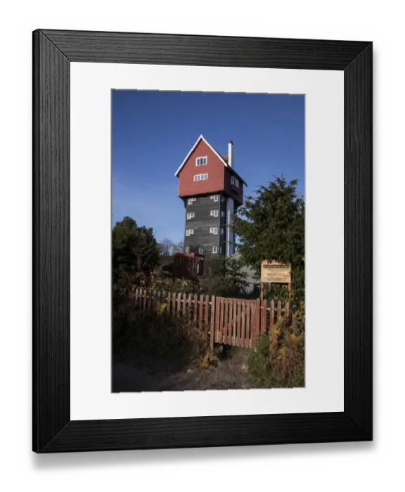 Framed Print : The House in the Clouds is a water tower at Thorpeness, Suffolk, UK. It was built in 1923 to receive water pumped Framed Print : The House in the Clouds is a water tower at Thorpeness, Suffolk, UK. It was built in 1923 to receive water pumped