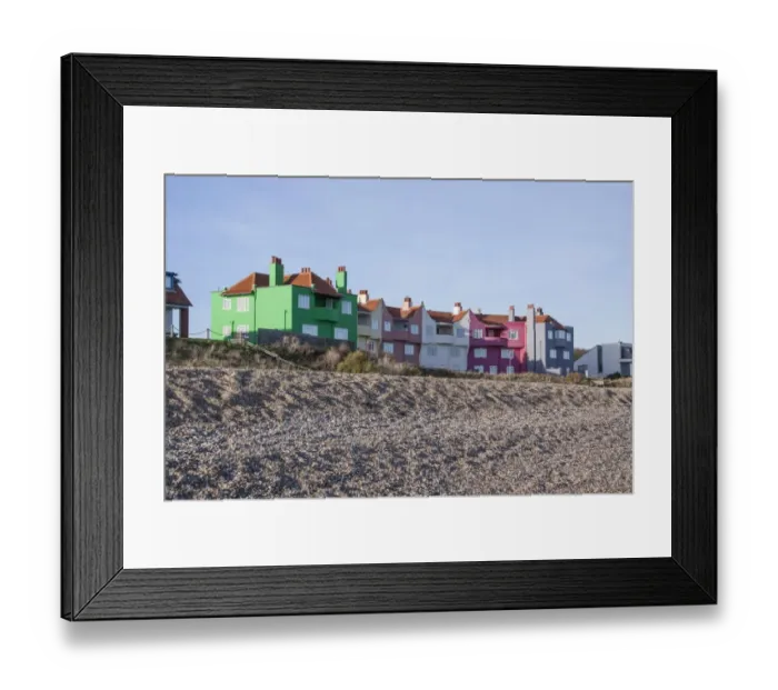 Framed Print : Brightly coloured houses by shingle beach at Thorpeness Suffolk