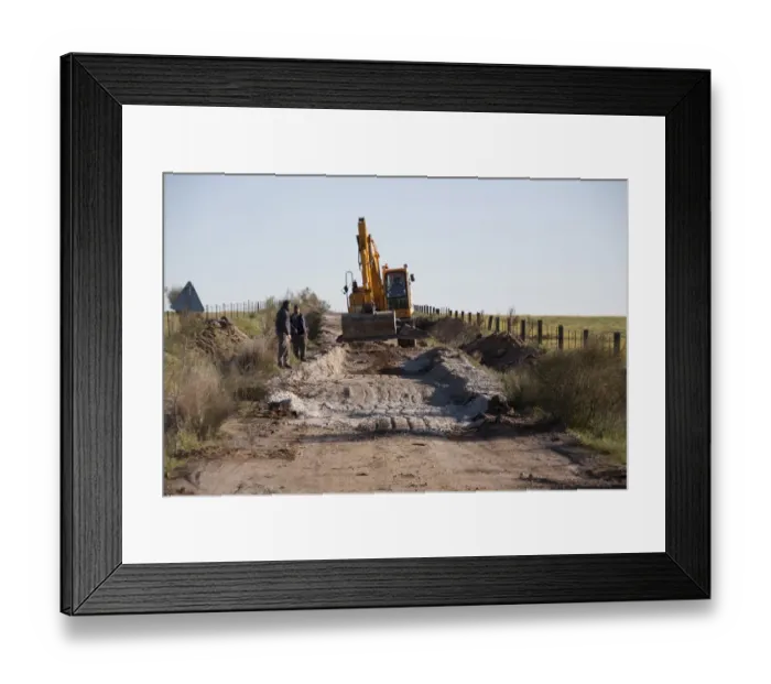 Framed Print : Repairing the road at Belen, Extremadura, Spain. the Cortijo Belen Road is well known to Bird watchers for the great Framed Print : Repairing the road at Belen, Extremadura, Spain. the Cortijo Belen Road is well known to Bird watchers for the great