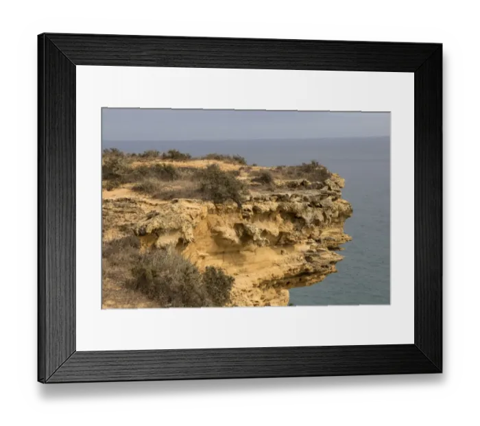 Framed Print : Sand stone rock erosion by sea and wind, Southern Portugal coast