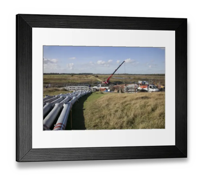 Framed Print : 2013 repair work to Minsmere River Tidal Sluice, which collects water from three channels before discharging the flow