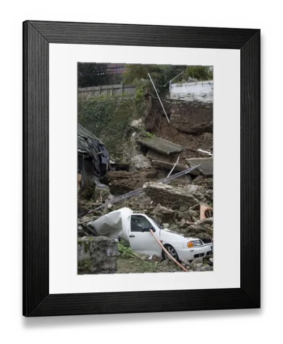 Framed Print : Landslip with van crushed under debris in coastal town, Quay Road, Looe, Cornwall, England, October 2008 Framed Print : Landslip with van crushed under debris in coastal town, Quay Road, Looe, Cornwall, England, October 2008