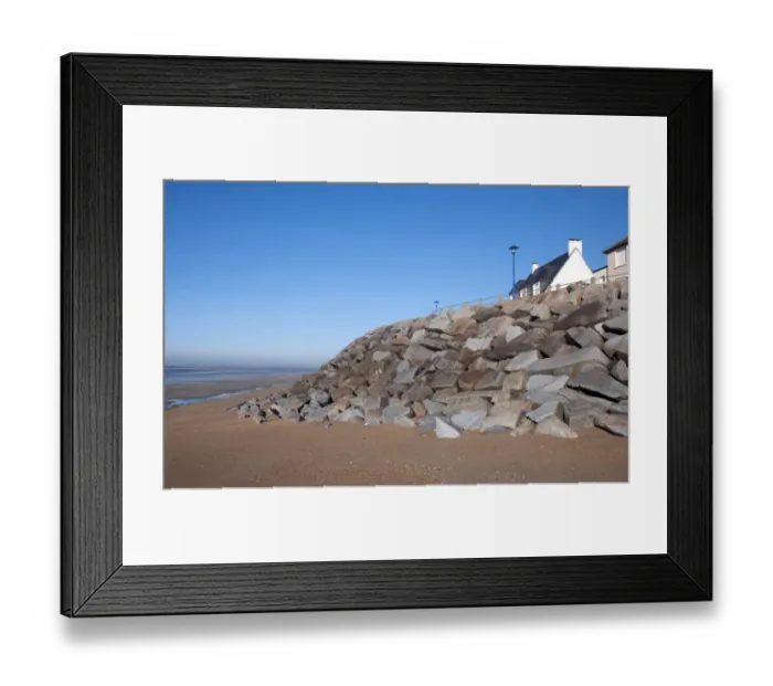 Framed Print : Sea defence boulders and houses, St. Martin de Brehal, Manche, Normandy, France, December