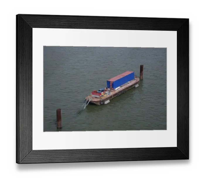 Framed Print : Barge with container moored on river in city, River Thames, London, England, april Framed Print : Barge with container moored on river in city, River Thames, London, England, april