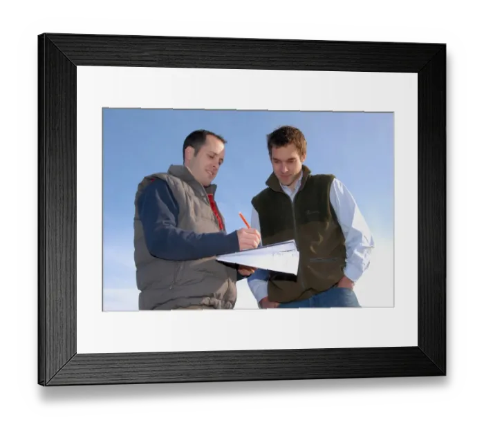 Framed Print : Agronomist and farmer working out field plan, England, October Framed Print : Agronomist and farmer working out field plan, England, October
