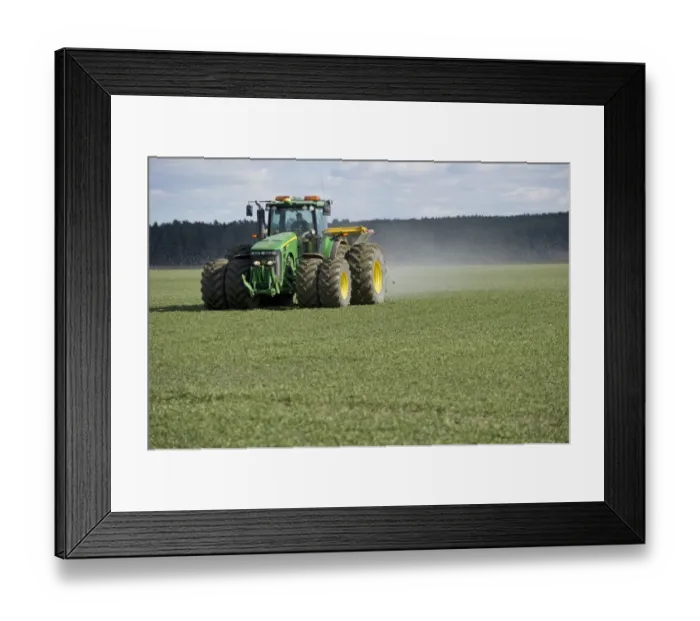 Framed Print : John Deere 8530 tractor with Bredal TX3500 spreader, spreading granular fertilizer on arable field, Tierp