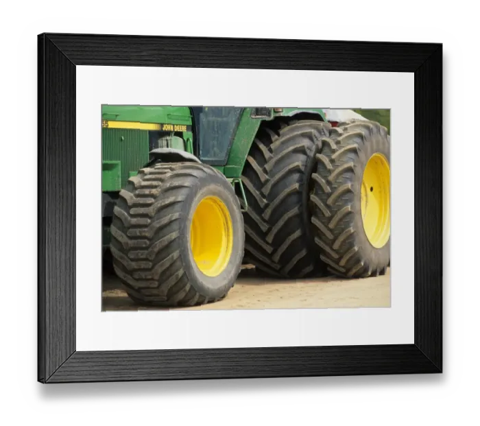 Framed Print : Farm machinery, big wheels on John Deere tractor, Sweden Framed Print : Farm machinery, big wheels on John Deere tractor, Sweden