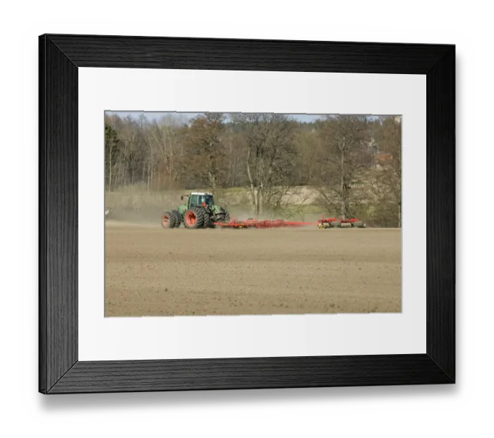 Framed Print : Fendt tractor pulling harrows and rollers, harrowing and rolling field, Sweden, spring