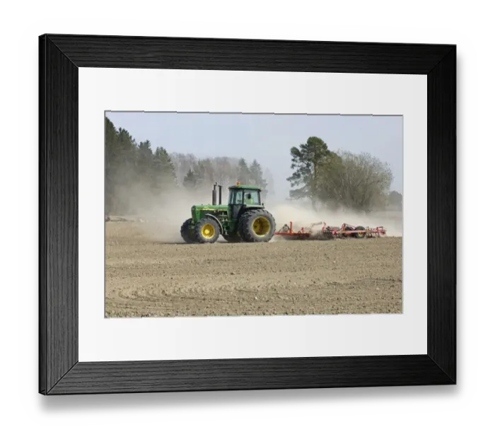 Framed Print : John Deere tractor pulling harrows, harrowing field with wind blown dust, Sweden, spring Framed Print : John Deere tractor pulling harrows, harrowing field with wind blown dust, Sweden, spring