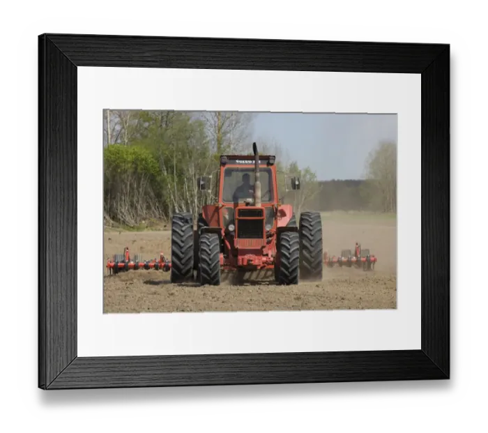 Framed Print : Volvo tractor pulling harrows, cultivating arable field, Sweden Framed Print : Volvo tractor pulling harrows, cultivating arable field, Sweden