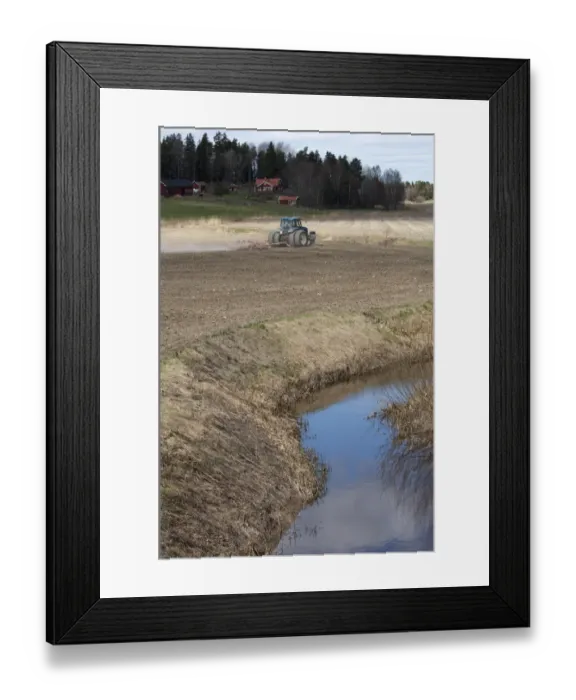 Framed Print : New Holland 8770 tractor with harrows, harrowing field seedbed beside small river, Sweden, may Framed Print : New Holland 8770 tractor with harrows, harrowing field seedbed beside small river, Sweden, may