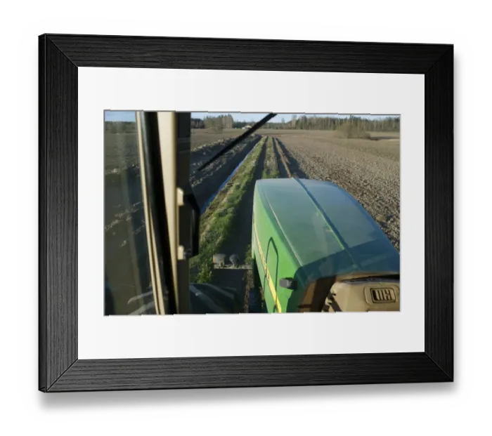 Framed Print : John Deere 9400 tractor, view from cab interior, driving along track with ditch at edge of arable field, Uppland Framed Print : John Deere 9400 tractor, view from cab interior, driving along track with ditch at edge of arable field, Uppland