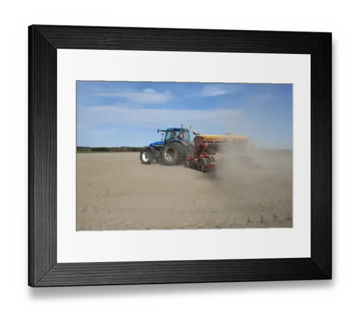 Framed Print : New Holland TM150 tractor with Vaderstad seed drill, with wind blown dust in field, Sweden, may Framed Print : New Holland TM150 tractor with Vaderstad seed drill, with wind blown dust in field, Sweden, may