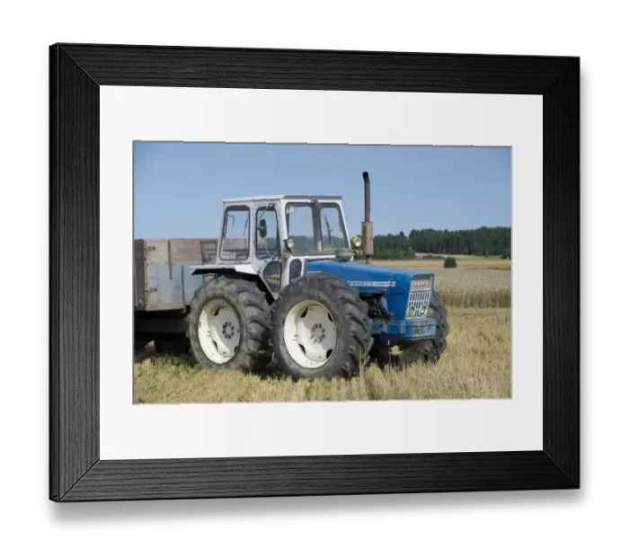 Framed Print : County tractor with trailer, in stubble field at harvest, Sweden, august Framed Print : County tractor with trailer, in stubble field at harvest, Sweden, august