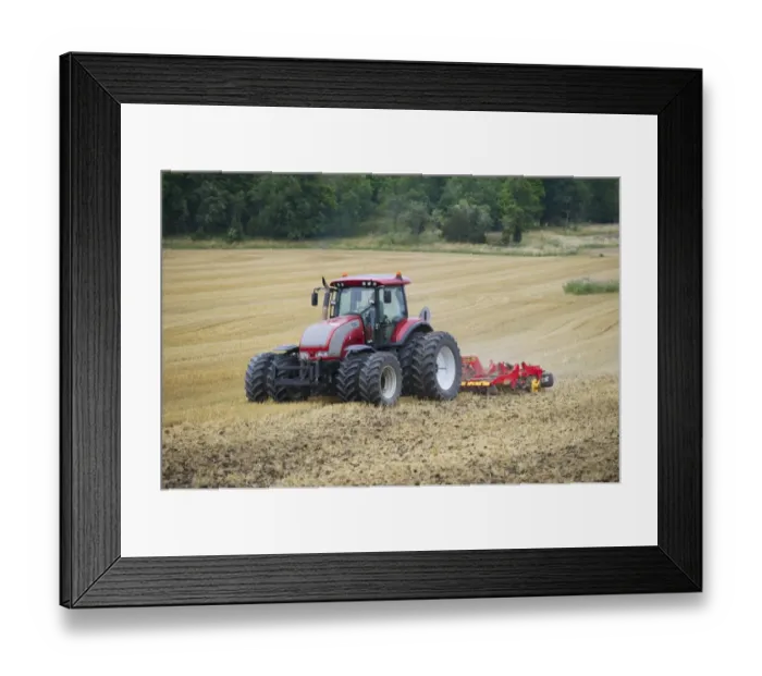 Framed Print : Valtra tractor pulling Vaderstad Carrier 420 cultivator, cultivating stubble field, Sweden, august Framed Print : Valtra tractor pulling Vaderstad Carrier 420 cultivator, cultivating stubble field, Sweden, august