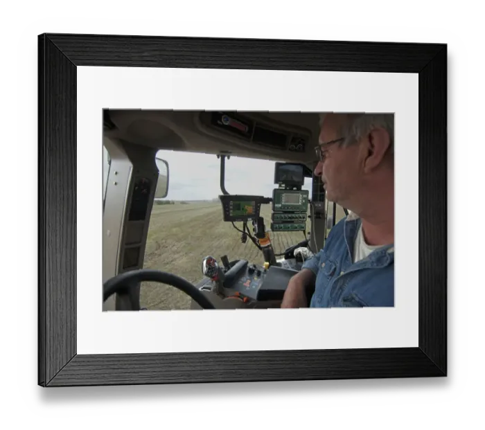 Framed Print : Case 225 tractor interior and farmer, with GPS and Samson vacuum slurry tanker control panel