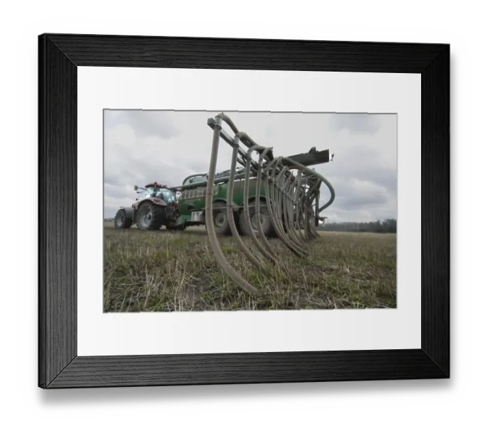 Framed Print : Case 225 tractor with Samson vacuum slurry tanker and slurry injector, injecting slurry into stubble field, Sweden, may