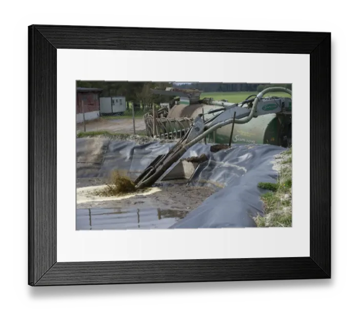 Framed Print : Samson vacuum slurry tanker and slurry injector, stirring and pumping arm filling up tank at slurry pond, Sweden, may Framed Print : Samson vacuum slurry tanker and slurry injector, stirring and pumping arm filling up tank at slurry pond, Sweden, may