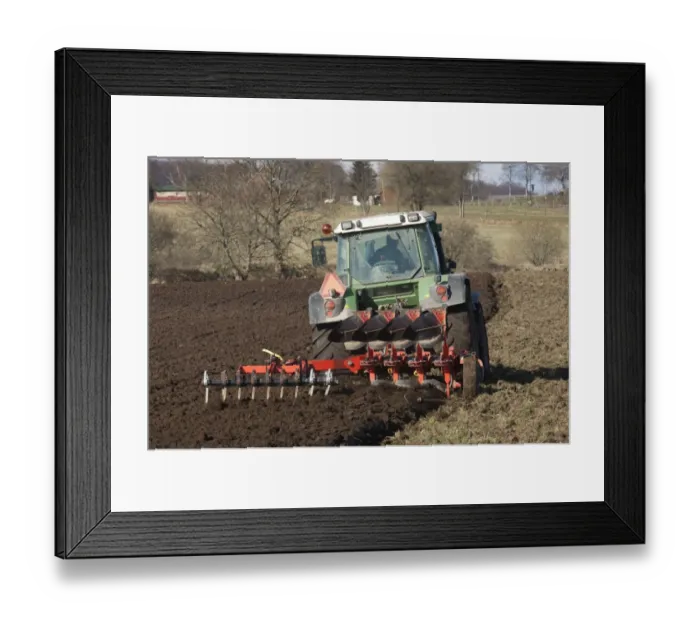 Framed Print : Tractor pulling four furrow reversible plough and small harrow, ploughing field, Skane, Sweden, winter Framed Print : Tractor pulling four furrow reversible plough and small harrow, ploughing field, Skane, Sweden, winter