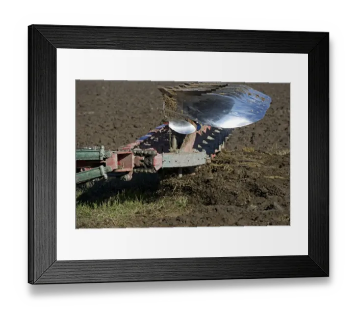 Framed Print : Close-up of reversible plough, ploughing arable field, Sweden, september Framed Print : Close-up of reversible plough, ploughing arable field, Sweden, september