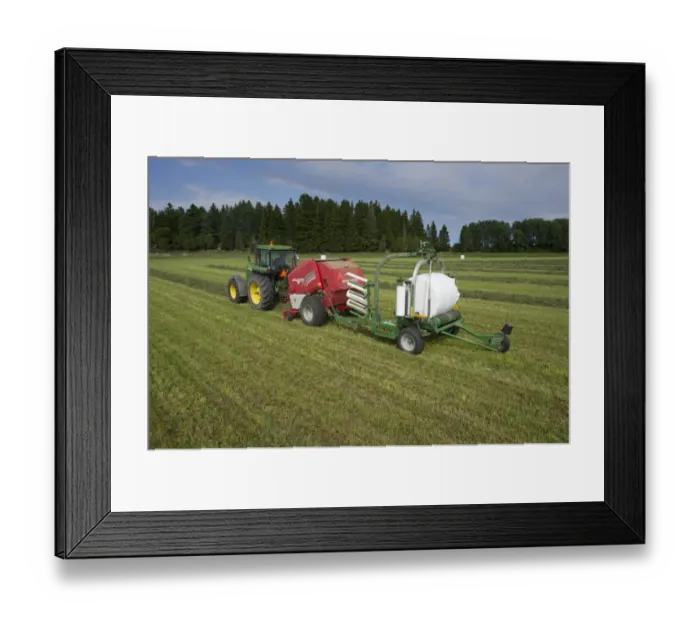 Framed Print : Silage crop, John Deere 4455 tractor with round baler and bale-wrapper, baling and wrapping round bales, Sweden, august Framed Print : Silage crop, John Deere 4455 tractor with round baler and bale-wrapper, baling and wrapping round bales, Sweden, august