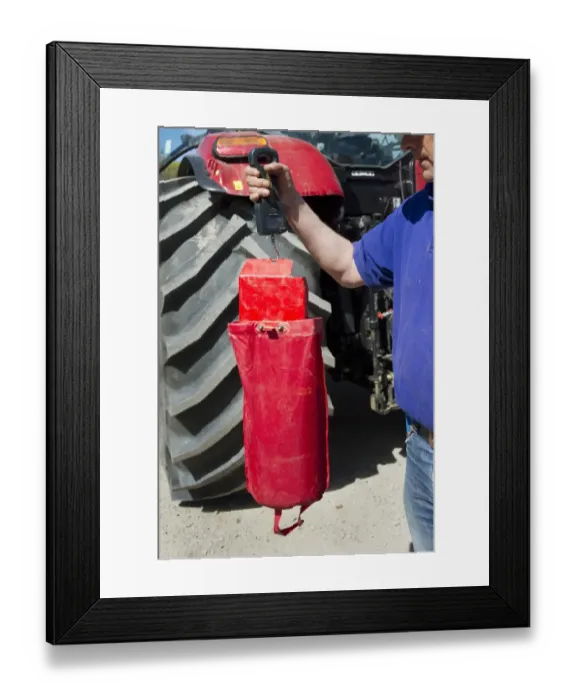 Framed Print : Farmer checking how much to sow on Vaderstad Rapid A 600S seed drill, Upplands Vasby, Sweden, may