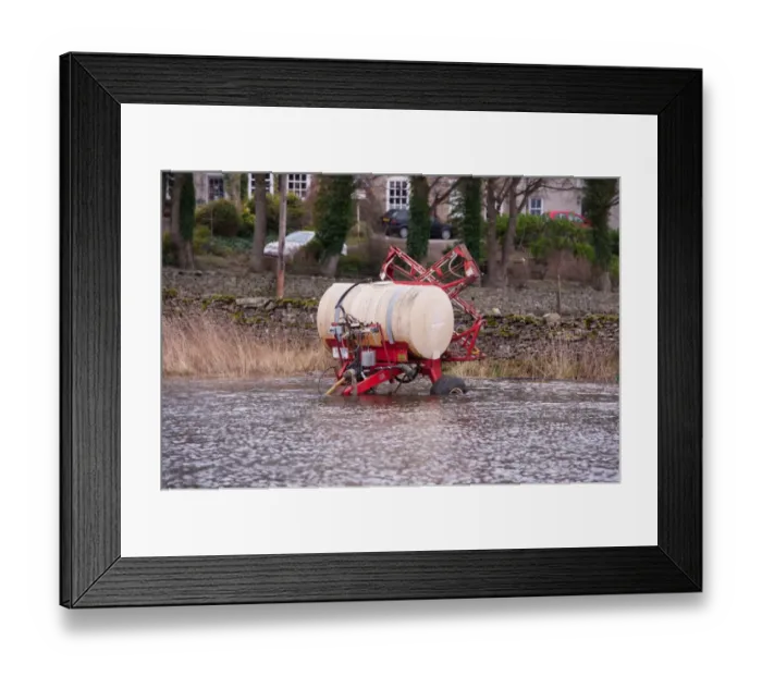 Framed Print : Lely crop sprayer in floodwater, West Burton, North Yorkshire, England, January