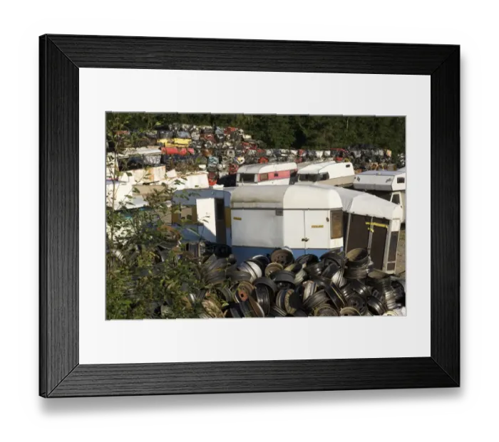 Framed Print : Scrapyard with wheel hubs, caravans and crushed cars, Sweden Framed Print : Scrapyard with wheel hubs, caravans and crushed cars, Sweden