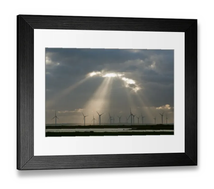 Framed Print : Wind turbines on windfarm with sunbeams through clouds at sunset, Little Cheyne Court, Romney Marsh, Kent, England Framed Print : Wind turbines on windfarm with sunbeams through clouds at sunset, Little Cheyne Court, Romney Marsh, Kent, England