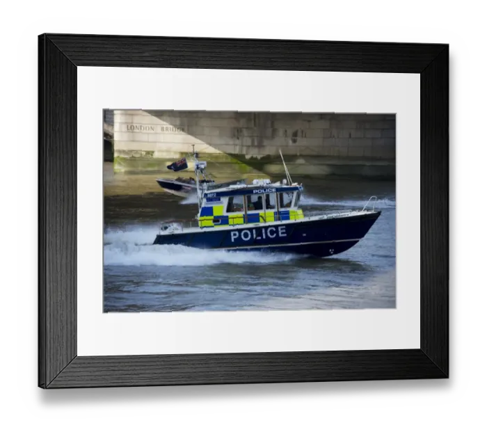 Framed Print : Police patrol boat patrolling city river, London Bridge, River Thames, London, England, april Framed Print : Police patrol boat patrolling city river, London Bridge, River Thames, London, England, april
