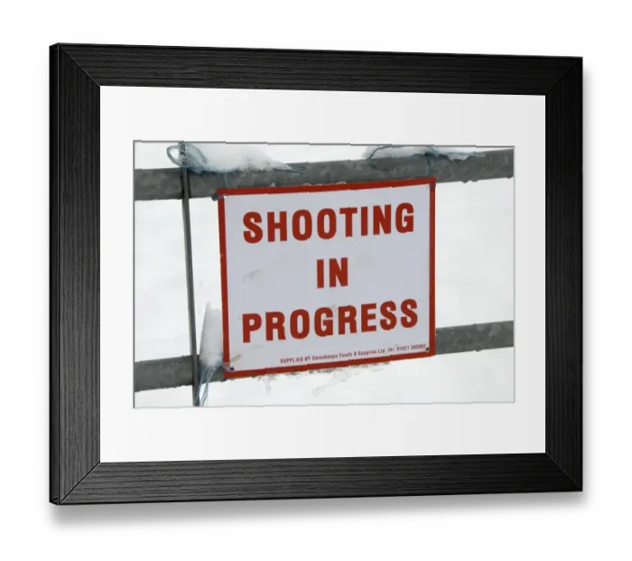 Framed Print : Shooting In Progress sign tied to gate in snow, warning of nearby shoot, near Mayfield, East Sussex, England, January